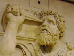 Oedipus blinds himself with golden pins