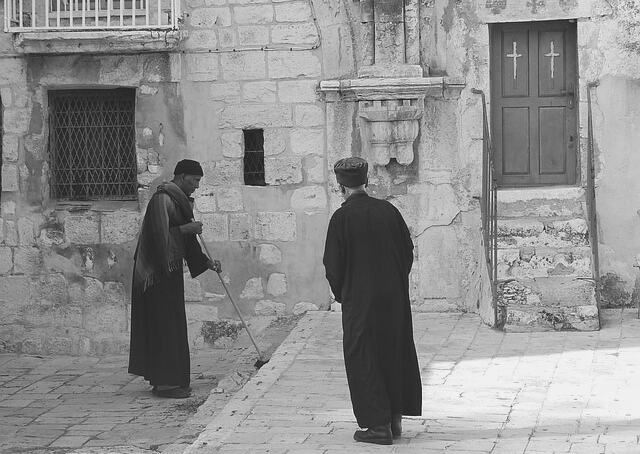 Priests in front of a Coptic Orthodox Church