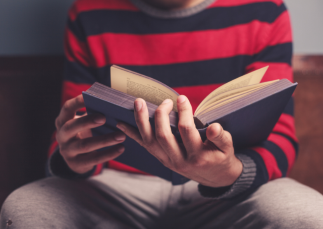 Person reading about the major similes in The Odyssey